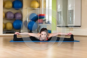 Woman practicing yoga Forward Bend Pose