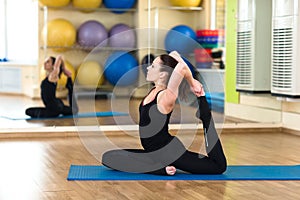 Woman practicing yoga Forward Bend Pose