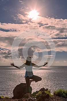 Woman Practicing Yoga on the Maui Hawaii Coast