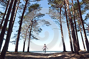 woman practicing yoga outdoors, in harmony with nature