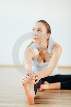 Woman practicing yoga pose at yoga healthy sport gym