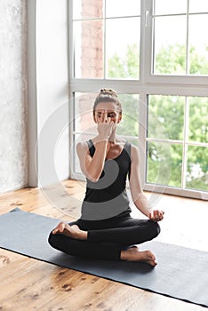 Woman practicing yoga in pranayama pose