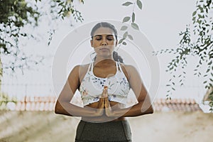 Woman practicing yoga for relaxation photo