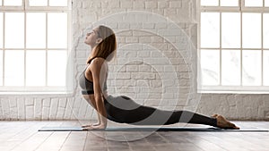 Woman practicing yoga, upward facing dog, Urdhva mukha shvanasana