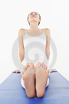 Woman practising yoga. Conceptual image