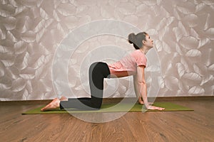 Woman practising yoga,home workout concept