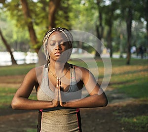 Woman practising yoga in a park