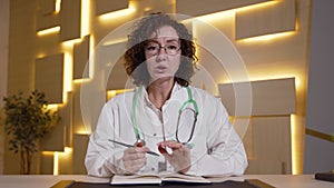 Woman practitioner consulting patient remotely