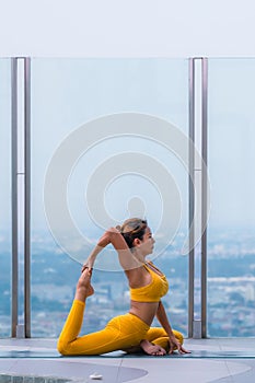 Woman pratice yoga workout training pose show body flexibilty and balance