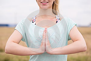 Woman in prayer pose