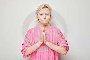Woman in prayer pose, gesture of gratitude and thanksgiving with hands