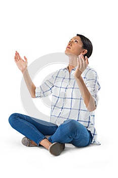 Woman praying against white background