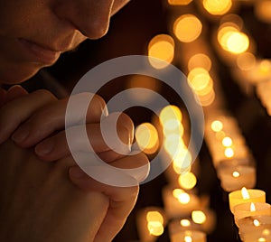 Woman praying in church cropped portrait photo