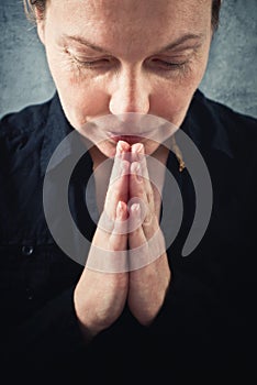 Woman praying and praising the God photo