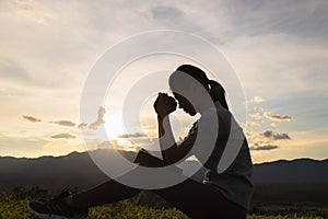 Woman praying while studying the bible Concept of learning, education, knowledge and religion. May God give you hope to overcome