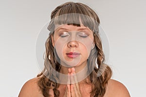 Woman praying to god - spirituality concept