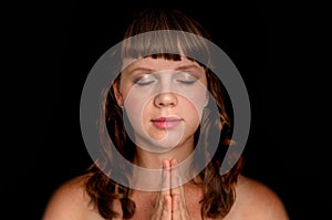 Woman praying to god - spirituality concept