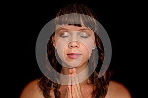 Woman praying to god - spirituality concept