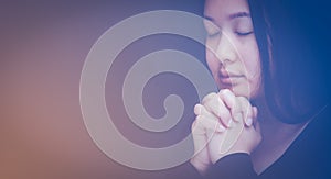 Woman praying and worship to GOD Using hands to pray in religious beliefs and worship christian in the church or in general