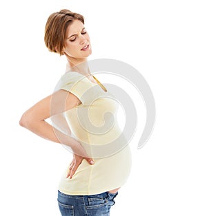 Woman, pregnant and back pain in studio by white background with frustrated face, hands and massage. Pregnant woman