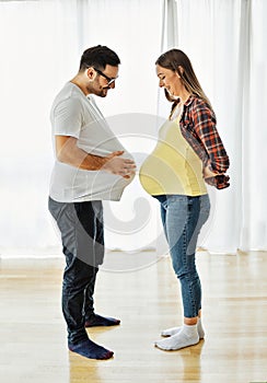 woman pregnant couple man pregnancy family mother love father happy husband baby wife belly expecting bonding happiness
