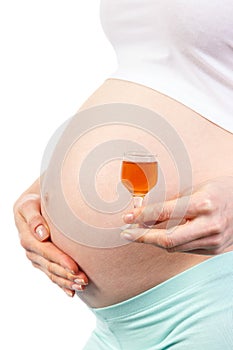 Woman in pregnant with glass of wine, concept of unhealthy lifestyles during pregnancy