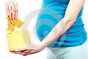 Woman in pregnant throwing medical pharmaceuticals, concept of reduction using pills and tablets in pregnancy