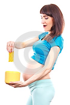 Woman in pregnant throwing medical pills or capsules, reduction of using tablets in pregnancy