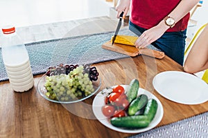 Woman prepare food, cutting corn. Vegetables. Cooking salad