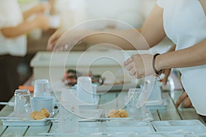 Woman prepare snack and beverage for conference