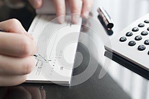 Woman prepare writing a check