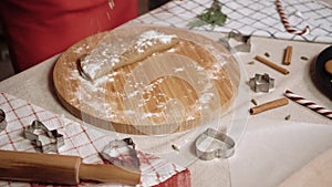 Woman prepares dough for making Christmas cookies