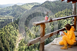 Woman prepares freeze-dried food for hiking in mountains