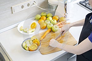 Woman prepares homemade fresh juice