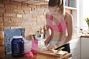 Woman preparing carbs shake photo