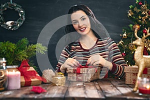 Woman preparing a Christmas present