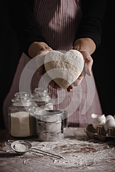 Woman preparing dough with love