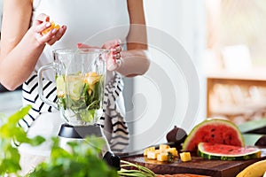 Woman preparing energetic smoothie