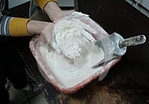 Woman preparing flour for cooking flour meal