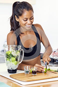 Woman preparing an inmunne booster juice