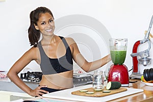 Woman preparing an inmunne booster juice photo