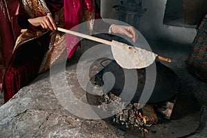 Woman preparing or making borek or bread dough, close-up