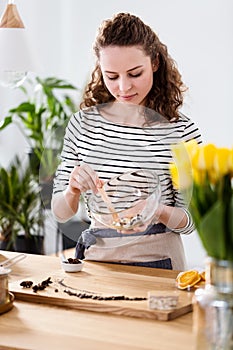 Woman preparing natural cosmetics