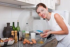 woman preparing omelet