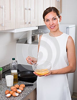 Woman preparing omelet