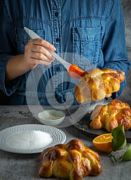 Woman preparing Pan de muertos bread of the dead for Mexican day of the dead