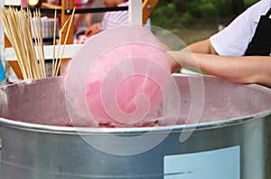 Woman preparing pink cotton candy