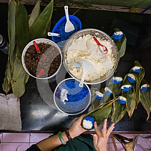 Woman Preparing Sticky Rice Parcels