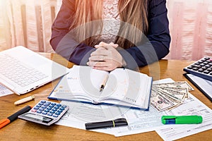 Woman preparing to fill 1040 form and for tax day