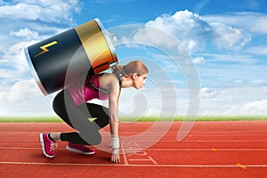 Woman preparing to run with a battery on her back